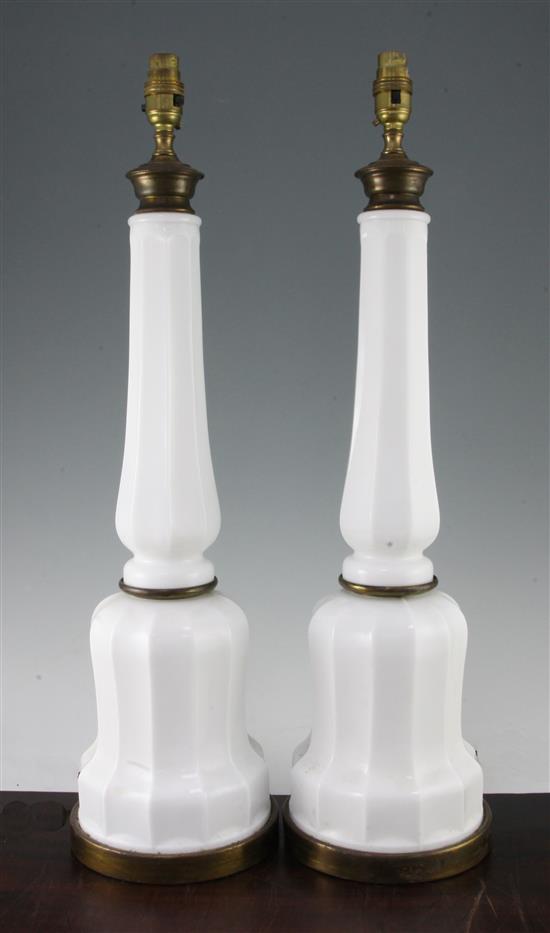 A decorative pair of white opaque glass facet cut mallet shaped table lamps, 2ft 2in.
